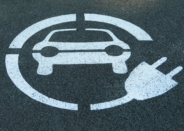 electric car charging cost road sign
